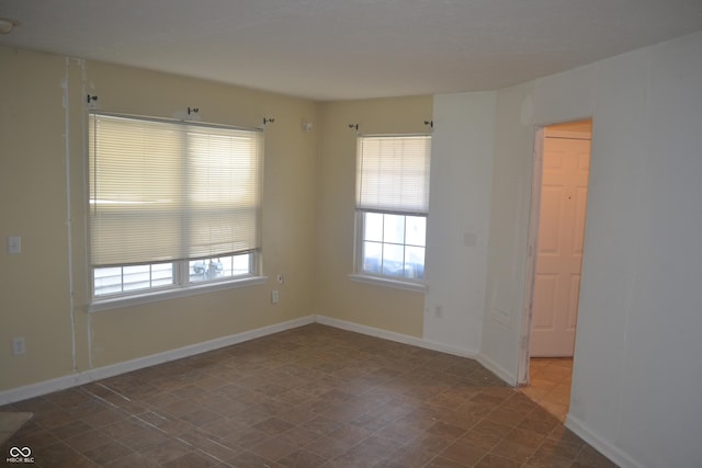 spare room with a wealth of natural light