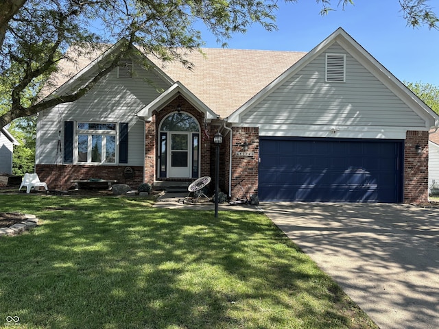 11720 Grenadier Ln, Indianapolis, IN 46229 - view of front of house with brick siding, an attached garage, concrete driveway, a front lawn, and entry steps