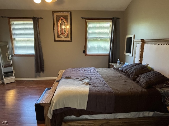 11720 Grenadier Ln, Indianapolis, IN 46229 - bedroom with wood finished floors, multiple windows, and baseboards