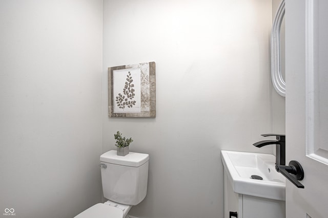 bathroom featuring toilet and sink