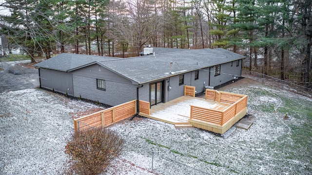 rear view of house with a wooden deck