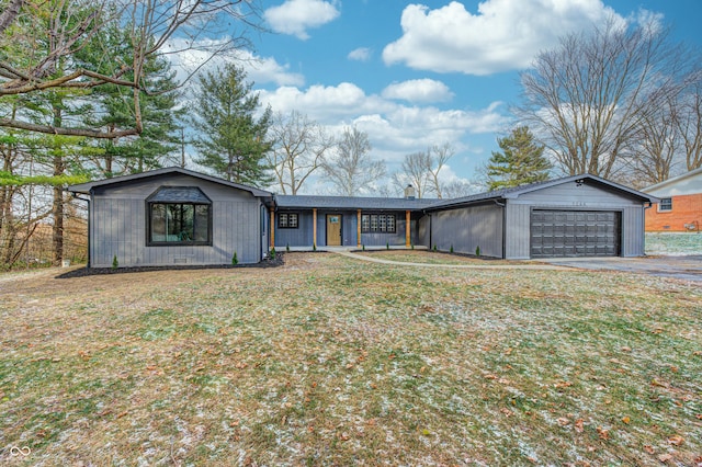 ranch-style house with a front yard and a garage