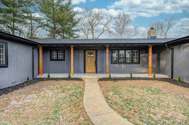 property entrance featuring covered porch