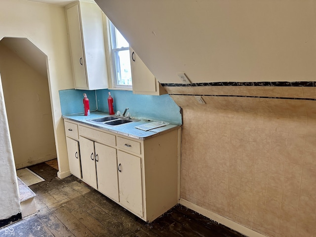 kitchen with sink and tile walls