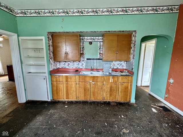 kitchen with decorative backsplash and sink