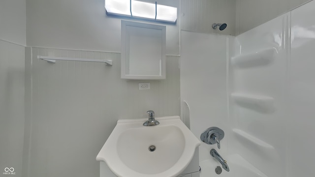 bathroom with shower / bathtub combination and sink