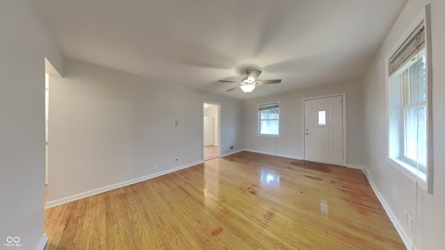 interior space with ceiling fan and light hardwood / wood-style flooring