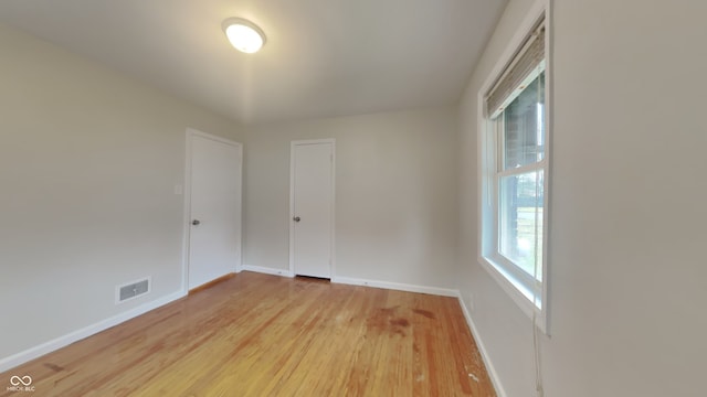 empty room featuring wood-type flooring