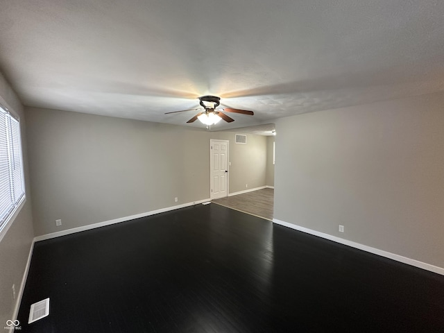 spare room with wood-type flooring and ceiling fan