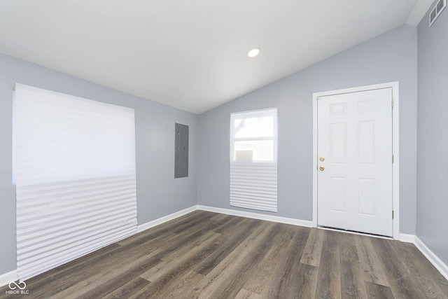 entryway featuring vaulted ceiling, electric panel, and dark hardwood / wood-style floors