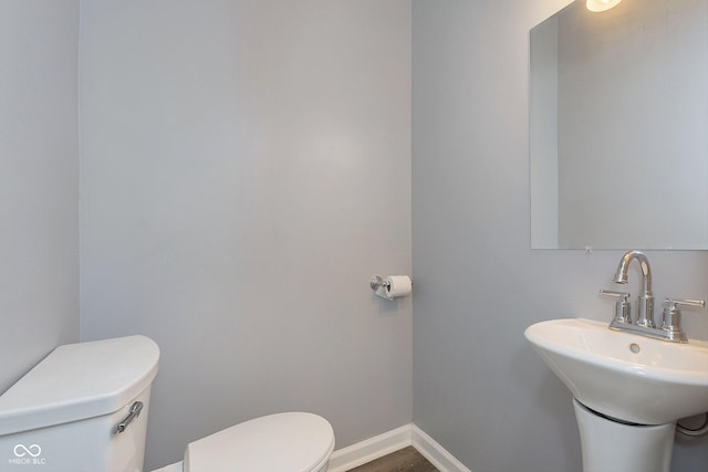 bathroom featuring sink and toilet