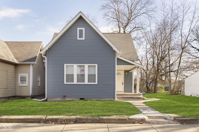 bungalow-style home with a front lawn