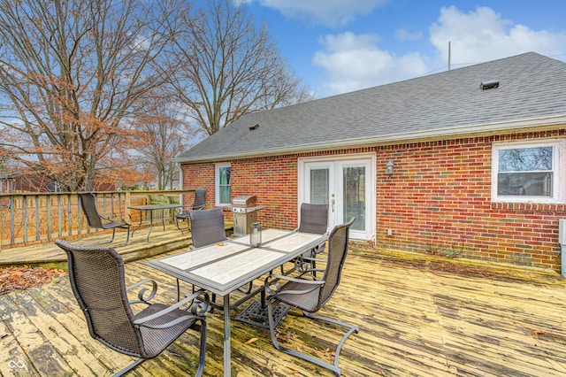 wooden deck featuring area for grilling