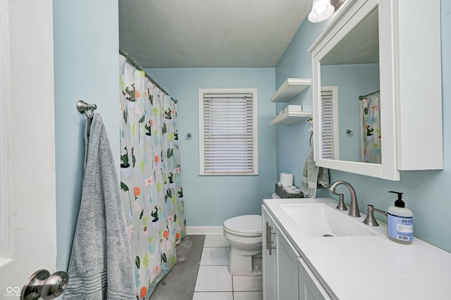 bathroom with tile patterned flooring, vanity, and toilet