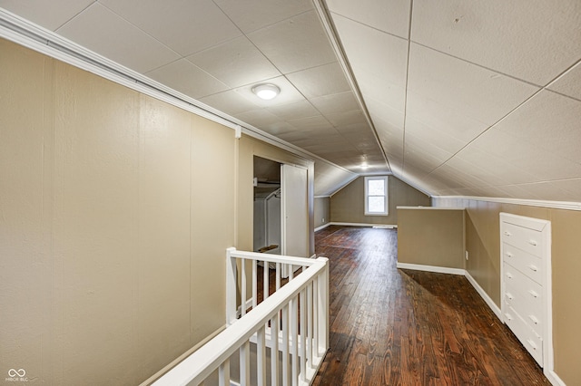 additional living space featuring dark hardwood / wood-style flooring and vaulted ceiling