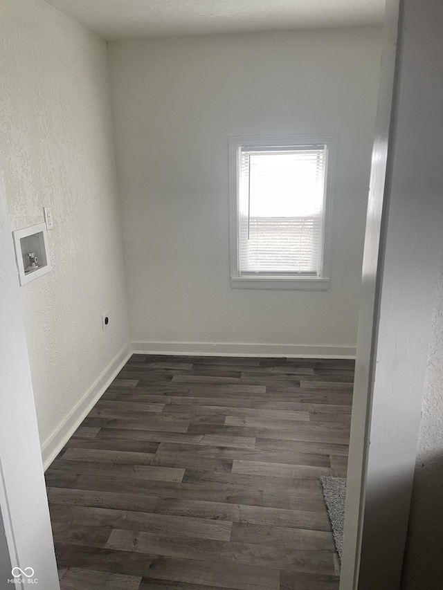 laundry area with dark hardwood / wood-style flooring and hookup for a washing machine