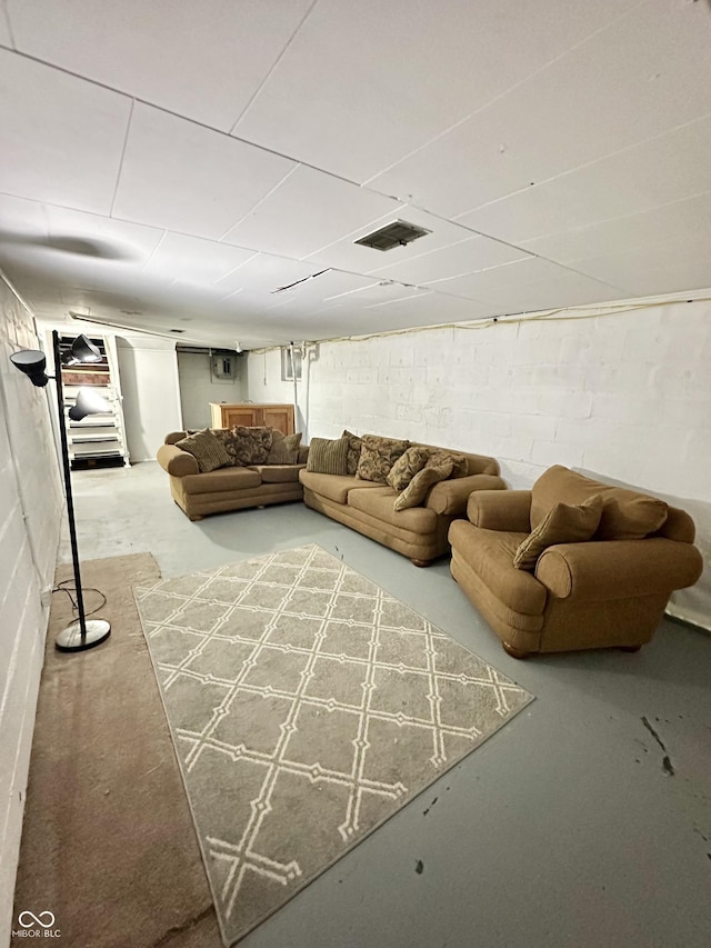 unfurnished living room with concrete flooring and visible vents