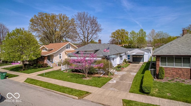view of front of property featuring a residential view, concrete driveway, a garage, and a front lawn