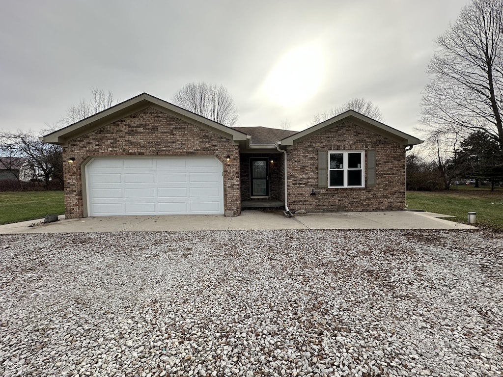 ranch-style house featuring a garage