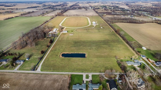 birds eye view of property featuring a rural view