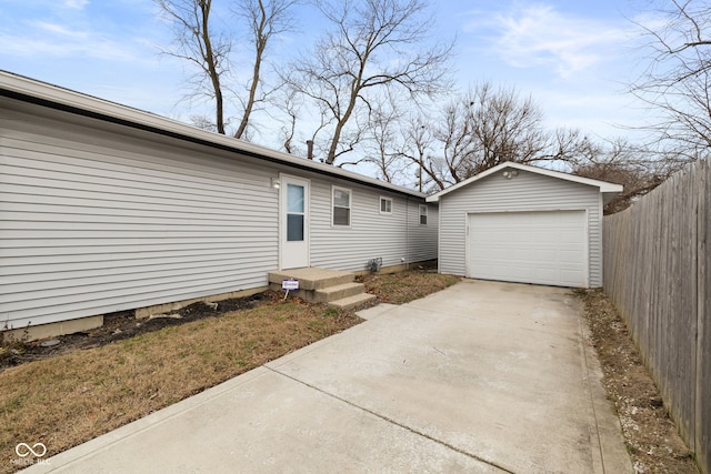 exterior space featuring a garage and an outdoor structure