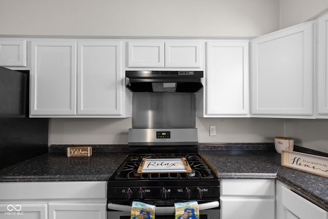 kitchen with stainless steel gas stove, exhaust hood, and white cabinets