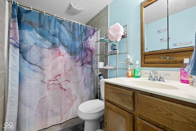 bathroom with vanity, a shower with shower curtain, and toilet