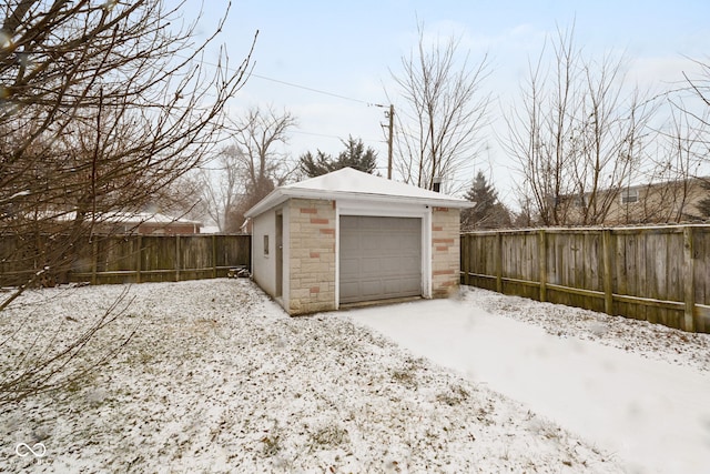 view of snow covered garage