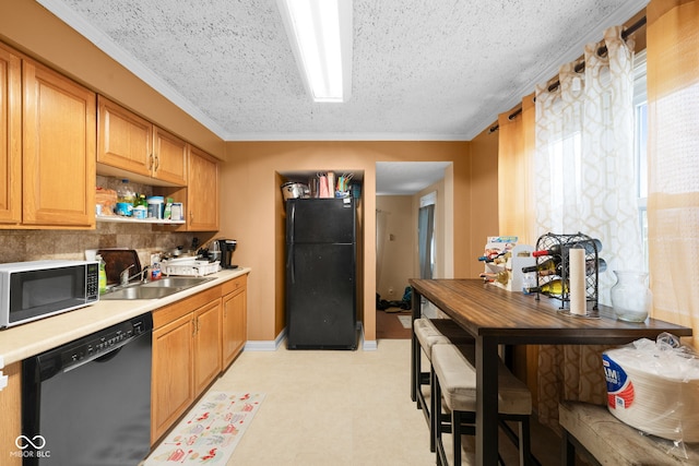 kitchen with tasteful backsplash, crown molding, sink, and black appliances