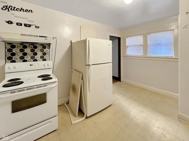 kitchen with white appliances and exhaust hood