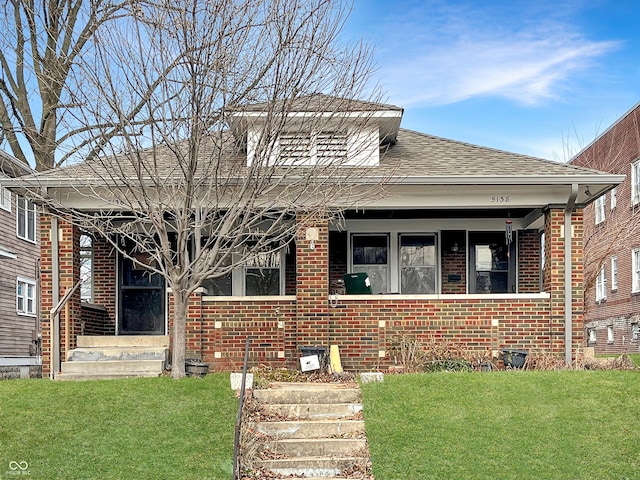 bungalow with a front lawn