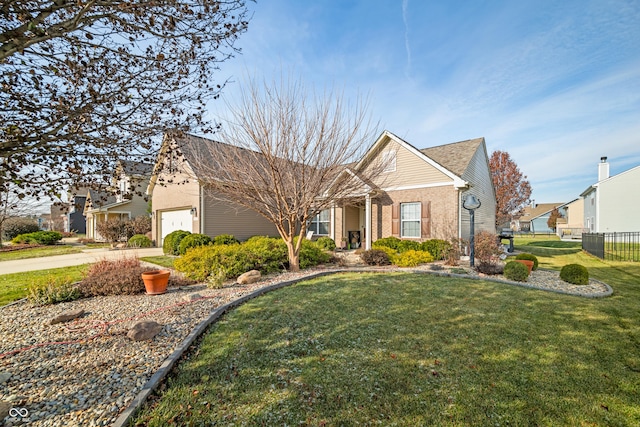 view of front facade with a garage and a front lawn