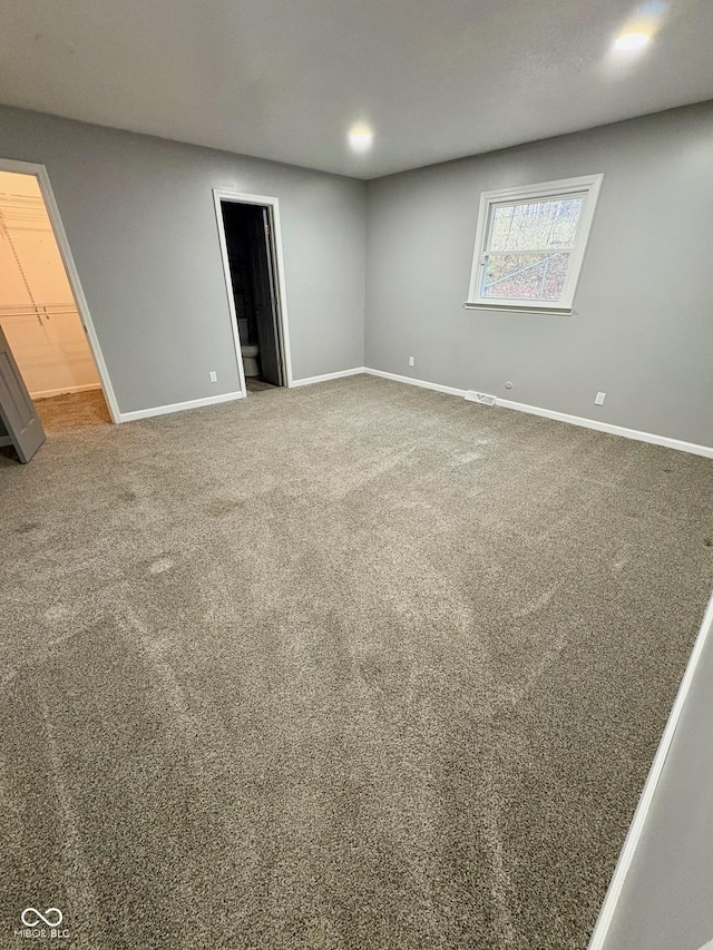 unfurnished room featuring carpet flooring