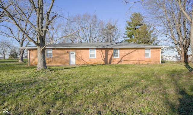 back of house with a yard