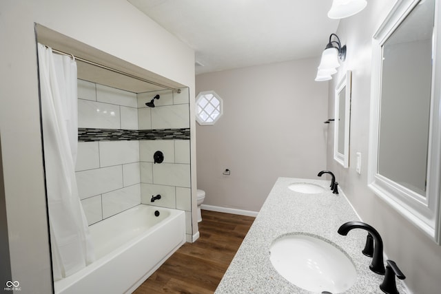 full bathroom with vanity, hardwood / wood-style flooring, toilet, and shower / bath combo with shower curtain