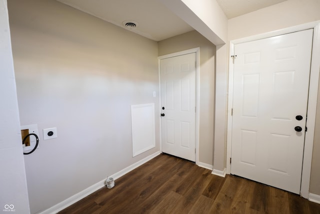 hall with dark wood-type flooring