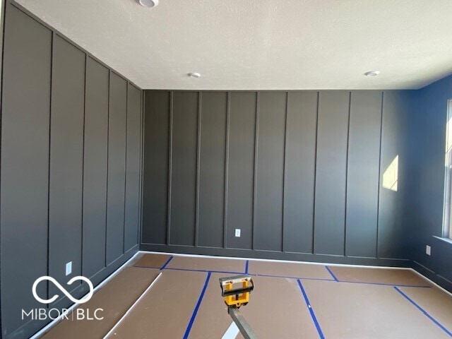 spare room with a textured ceiling