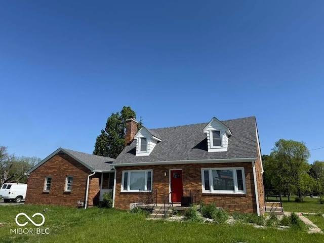 3192 E Main St, Plainfield, IN 46168 - cape cod house featuring brick siding, a chimney, and a front lawn