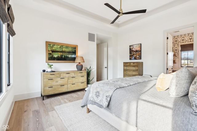 bedroom featuring ceiling fan and light hardwood / wood-style flooring