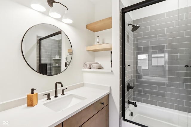 bathroom with tiled shower / bath combo and vanity