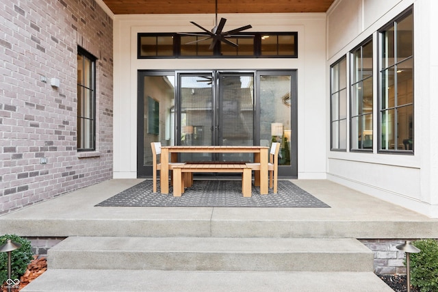 property entrance with ceiling fan