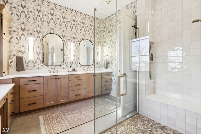 bathroom with vanity and a shower with shower door