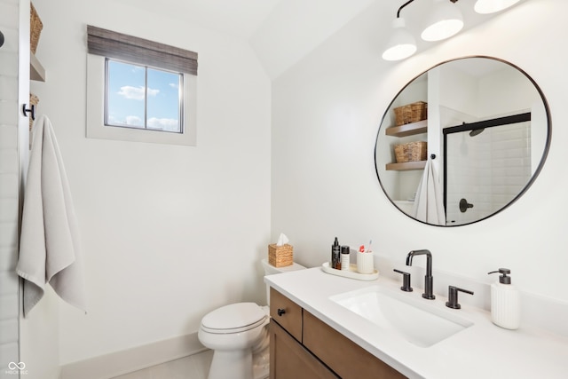 bathroom featuring vanity, a shower with shower door, tile patterned floors, and toilet