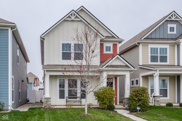 craftsman house with a front lawn