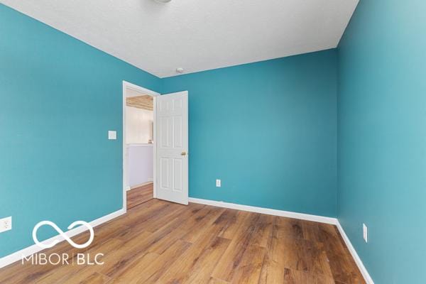 spare room featuring light hardwood / wood-style flooring