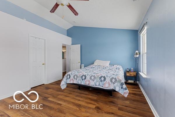 bedroom featuring wood-type flooring, ceiling fan, and lofted ceiling