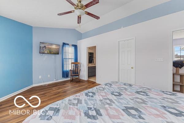 bedroom with ceiling fan, wood-type flooring, lofted ceiling, and connected bathroom