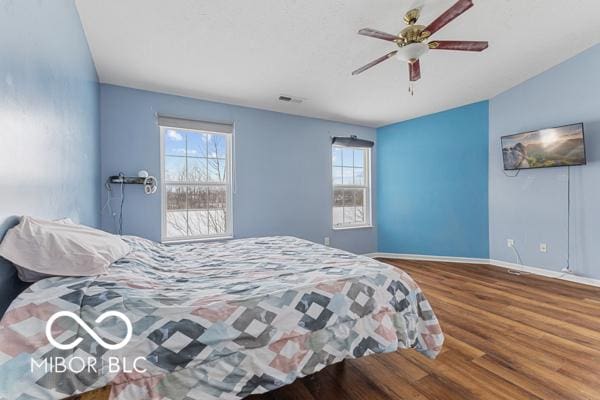 bedroom featuring hardwood / wood-style flooring and ceiling fan