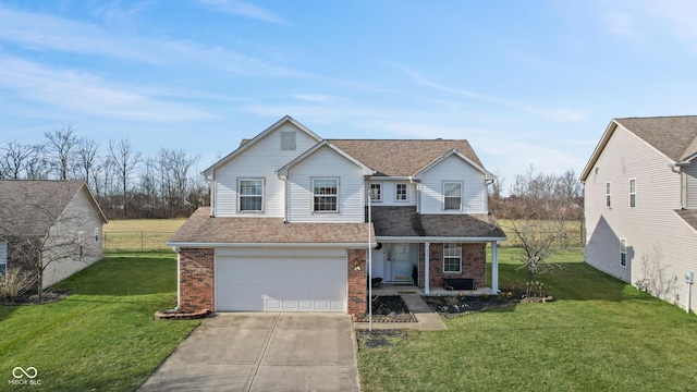 view of front of property with a garage and a front lawn