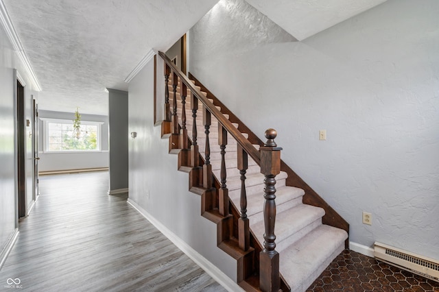 staircase with hardwood / wood-style flooring and crown molding